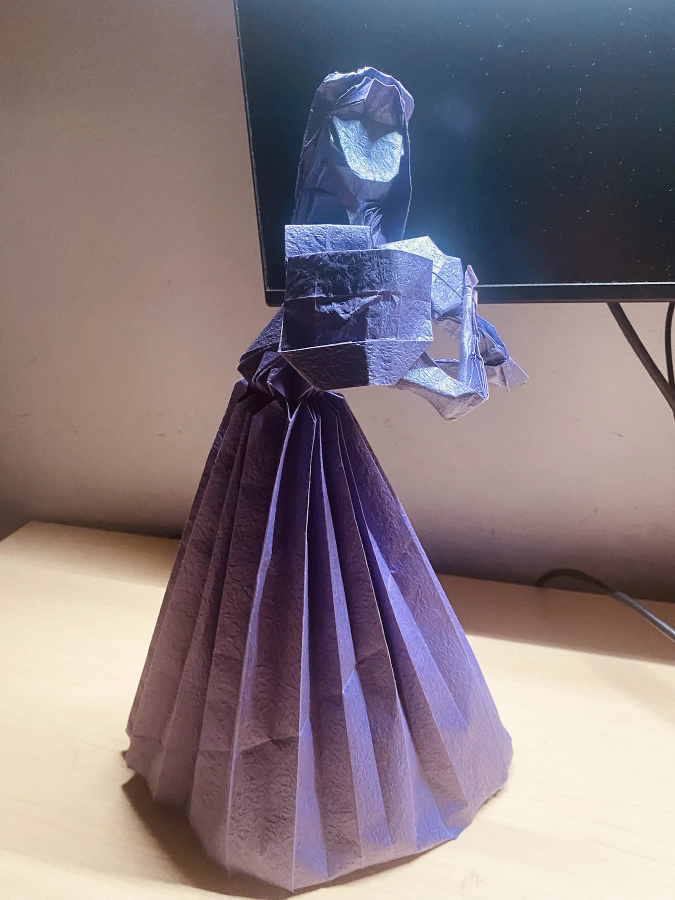 Dark paper origami violinist